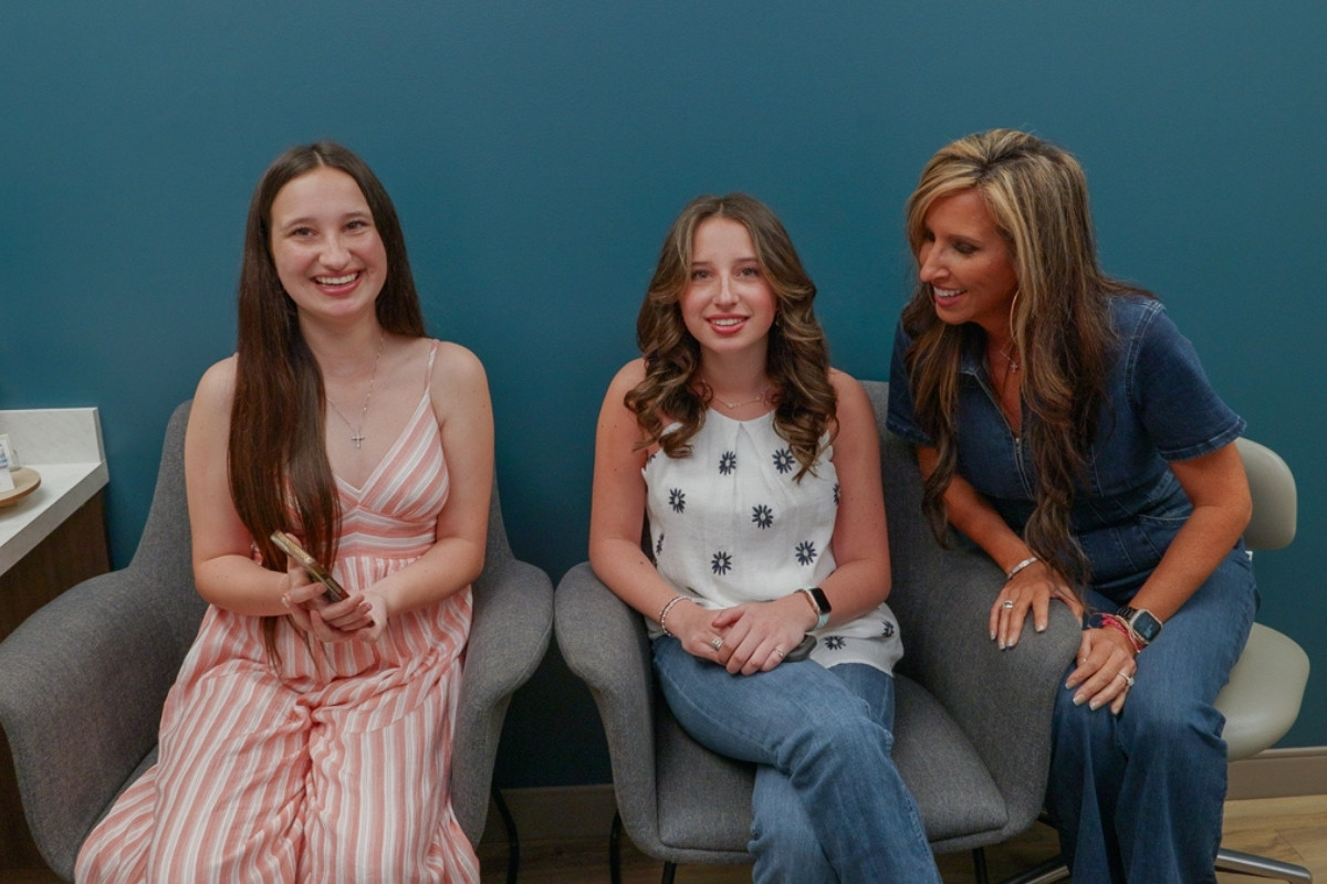 Patients smiling during orthodontic consultation in Chesapeake VA at Glass Orthodontics