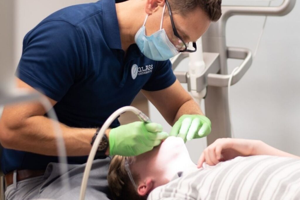 Myofunctional Therapy Treatment – Glass Orthodontics Orthodontist performing myofunctional therapy and oral function treatment in Chesapeake VA orthodontic office near Elizabeth City NC and Moyock NC