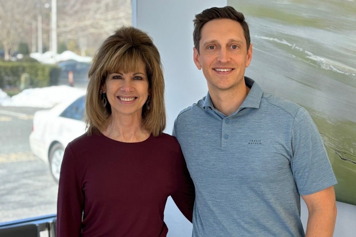 Patients smiling after TMJ therapy in Chesapeake VA orthodontic office near Elizabeth City NC and Moyock NC for jaw pain and bite alignment treatment