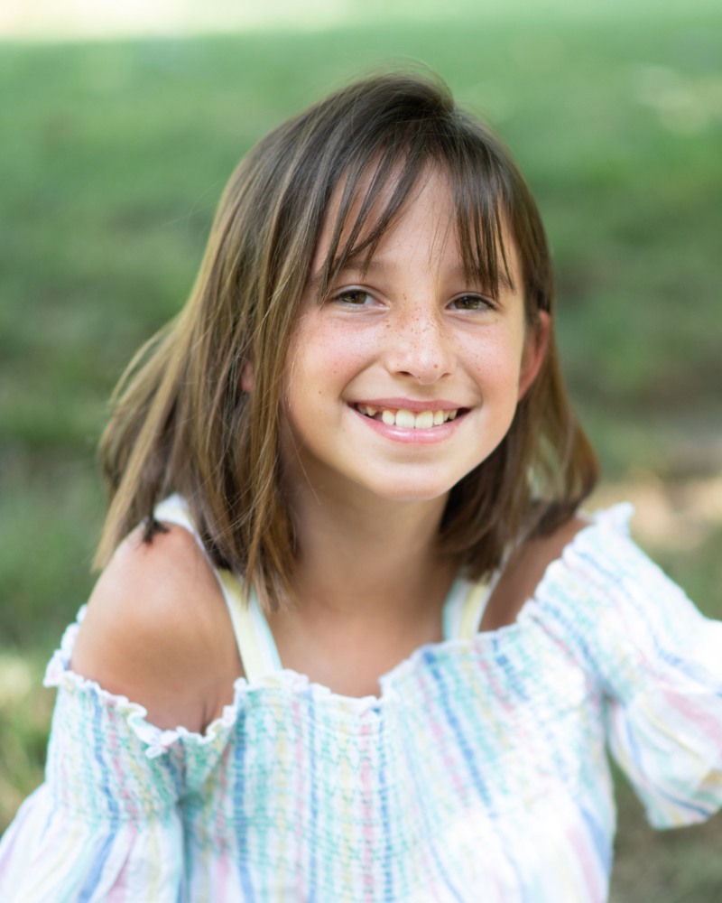 Young orthodontic patient smiling with straight teeth in Chesapeake VA