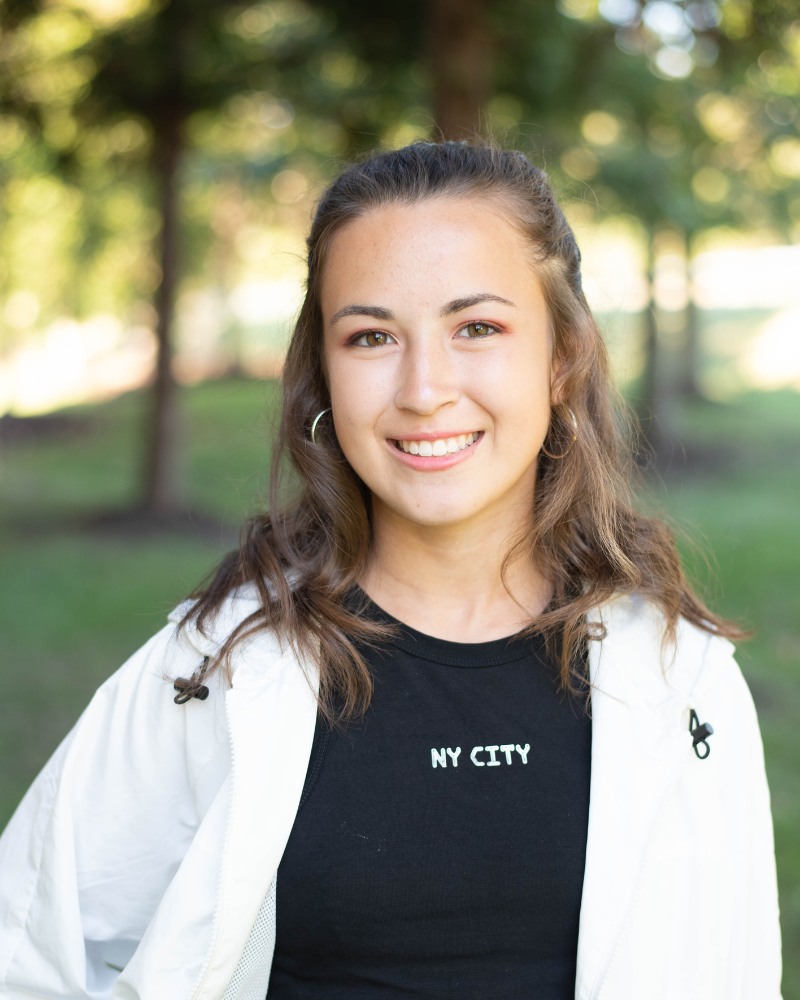 Young adult patient smiling with aligned teeth after orthodontic treatment Chesapeake VA