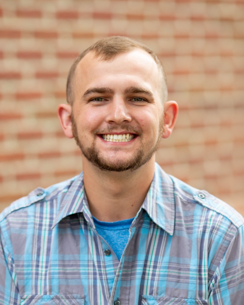 Adult orthodontic patient smiling with straight teeth in Chesapeake VA