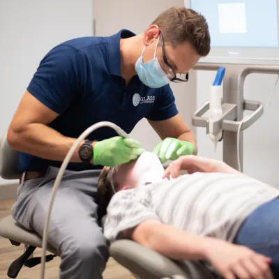 What is airway orthodontics? 3 Dr. Glass works on a patient's teeth at glass orthodontics, representing how airway orthodontics helps breathing