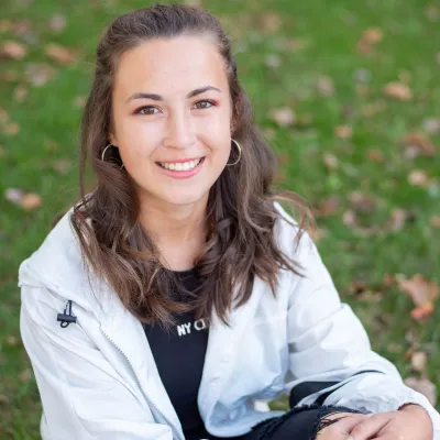 Why quality orthodontics matters 3 Teenage girl patient posing for a photo at glass orthodontics, representing benefits of orthodontic treatment